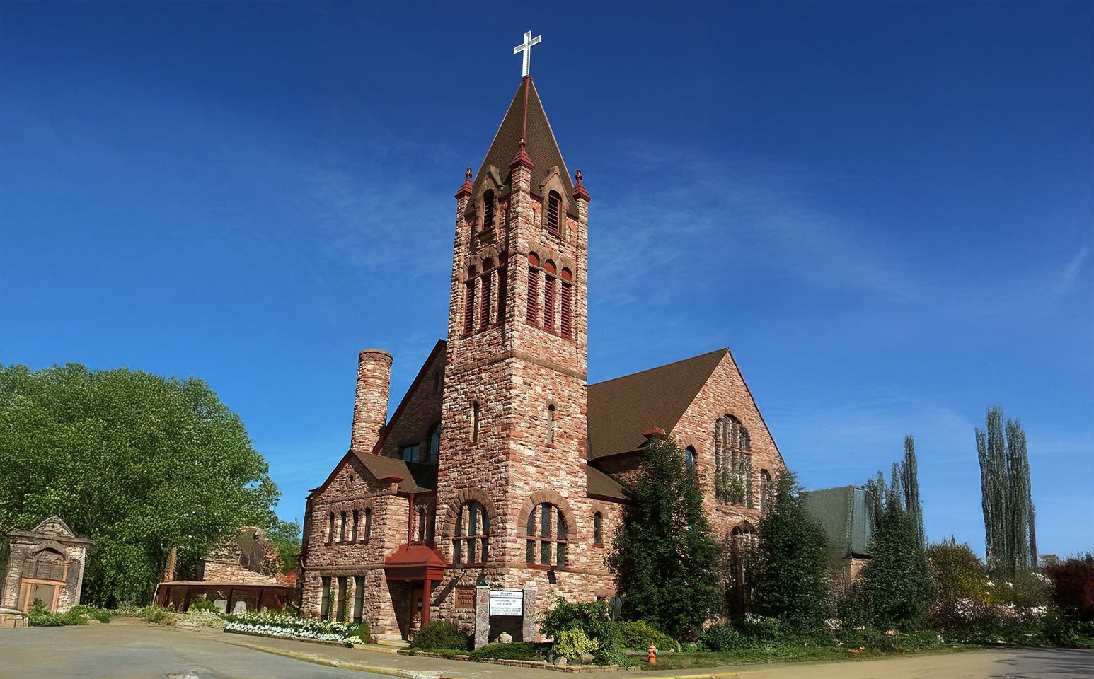 Red brick church exterior with tower
